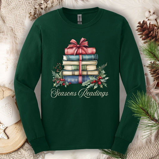 Forest Green long sleeve tee with watercolor stacked Christmas books, red bow, holly, and "Seasons Readings" text.