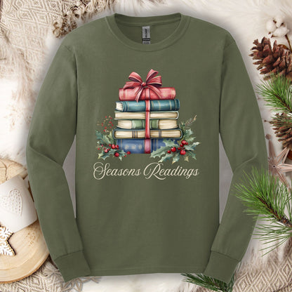 Military Green long sleeve tee with watercolor stack of vintage Christmas books, bow, holly, and "Seasons Readings" text.