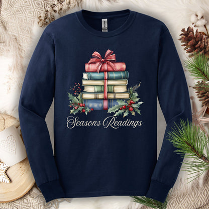 Navy long sleeve tee with watercolor stacked Christmas books, bow, holly, and "Seasons Readings" text.