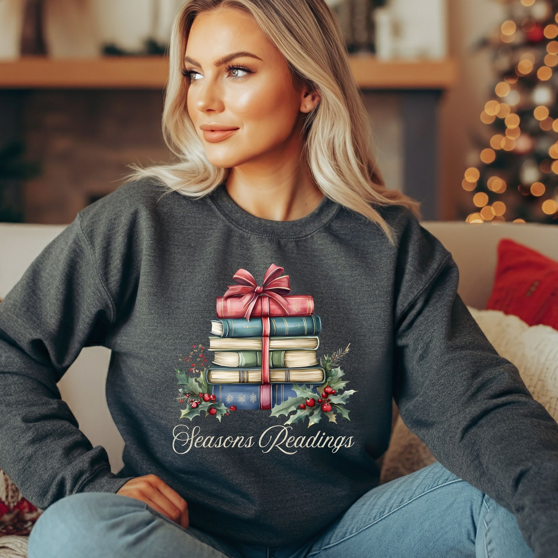 Charcoal gray sweatshirt with a watercolor stack of Christmas books, holly, and "Seasons Readings" text.