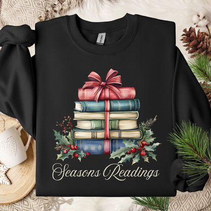 Black Seasons Readings sweatshirt with a watercolor stack of vintage Christmas books, holly, and pine.
