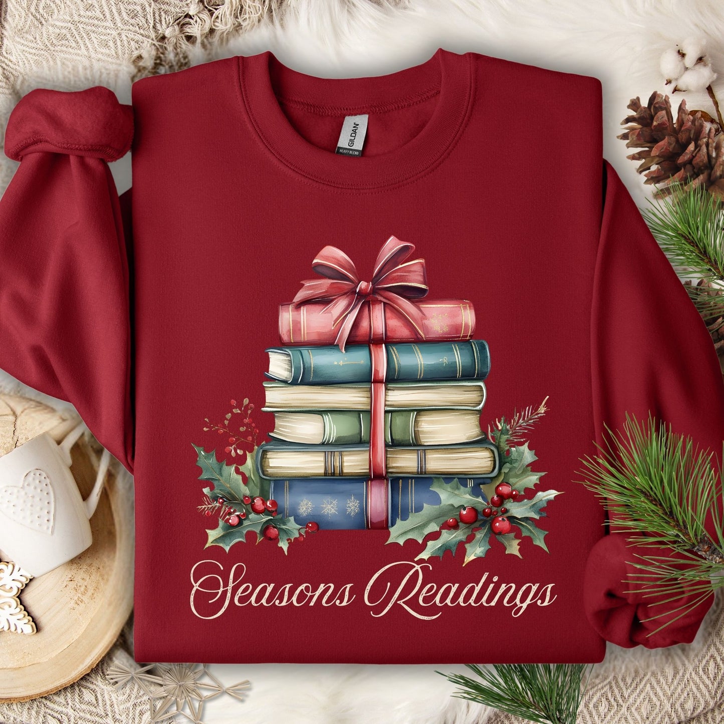 Cardinal Red Seasons Readings sweatshirt with a watercolor stack of vintage Christmas books, holly, and pine.