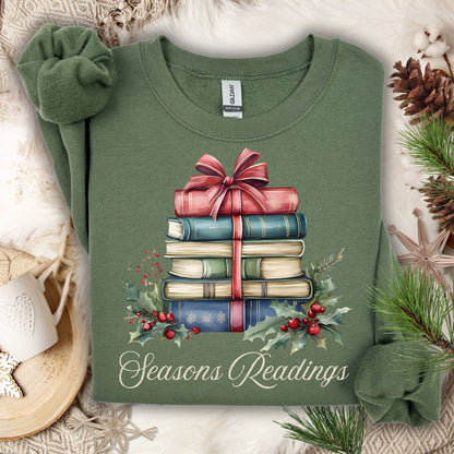 Military Green Seasons Readings sweatshirt with a watercolor stack of vintage Christmas books, holly, and pine.