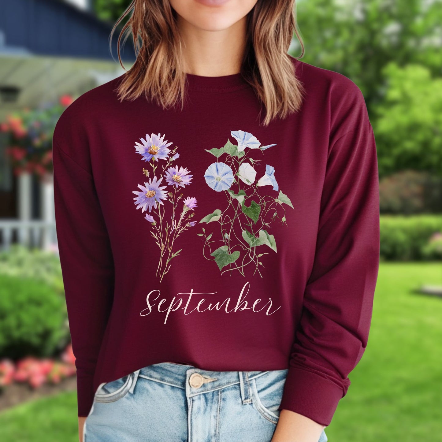 Maroon long-sleeve tee with watercolor asters, morning glories, and "September" text.