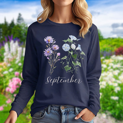 Navy long-sleeve tee with watercolor asters, morning glories, and "September" script on the chest.