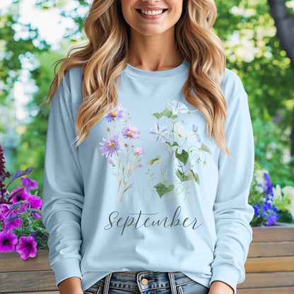 Light blue long sleeve tee with watercolor asters, morning glories, and "September" script.