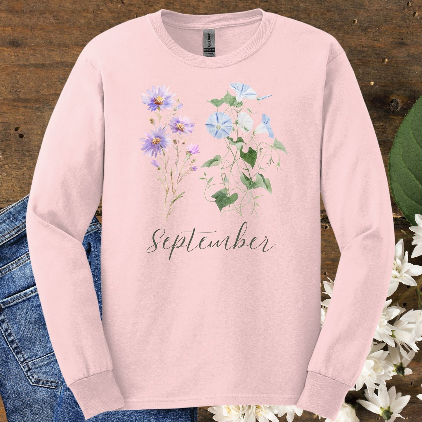 Light pink long-sleeve tee with watercolor asters, morning glories, and "September" script.