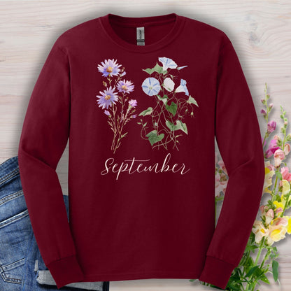 Maroon long-sleeve tee with watercolor asters, morning glories, and "September" script.