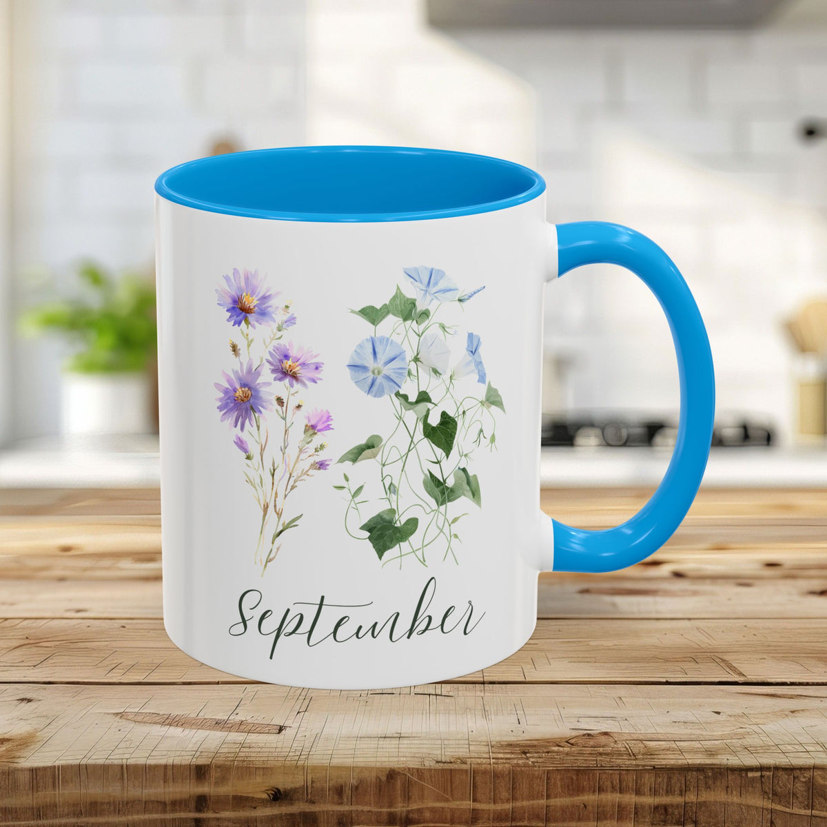11oz white ceramic mug with light blue interior and handle, featuring watercolor asters, morning glories, and "September.