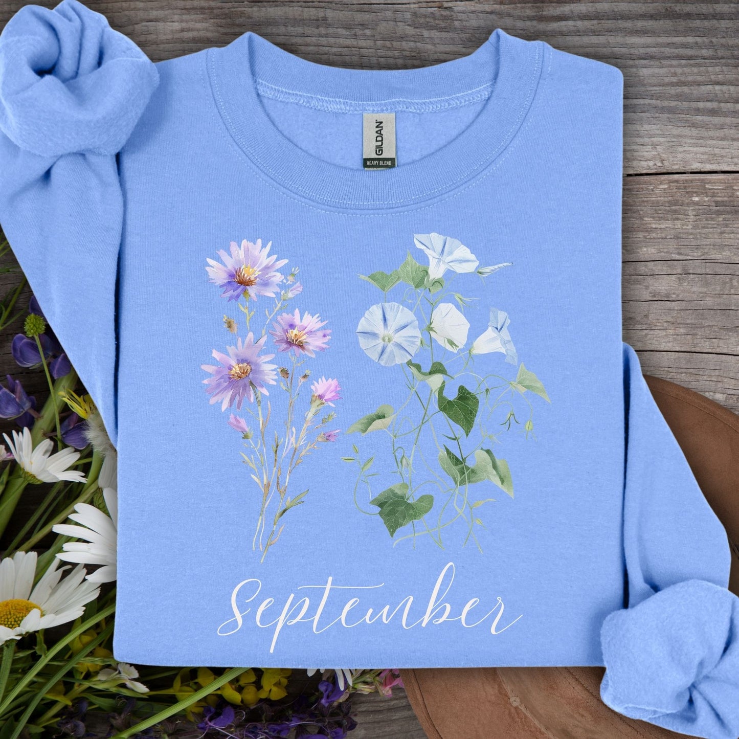 Carolina Blue sweatshirt with watercolor morning glory and aster flowers, plus "September" text.