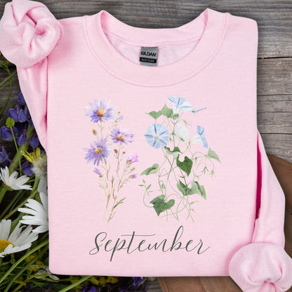 Light pink Gildan sweatshirt with watercolor morning glory and aster flowers, "September" text.