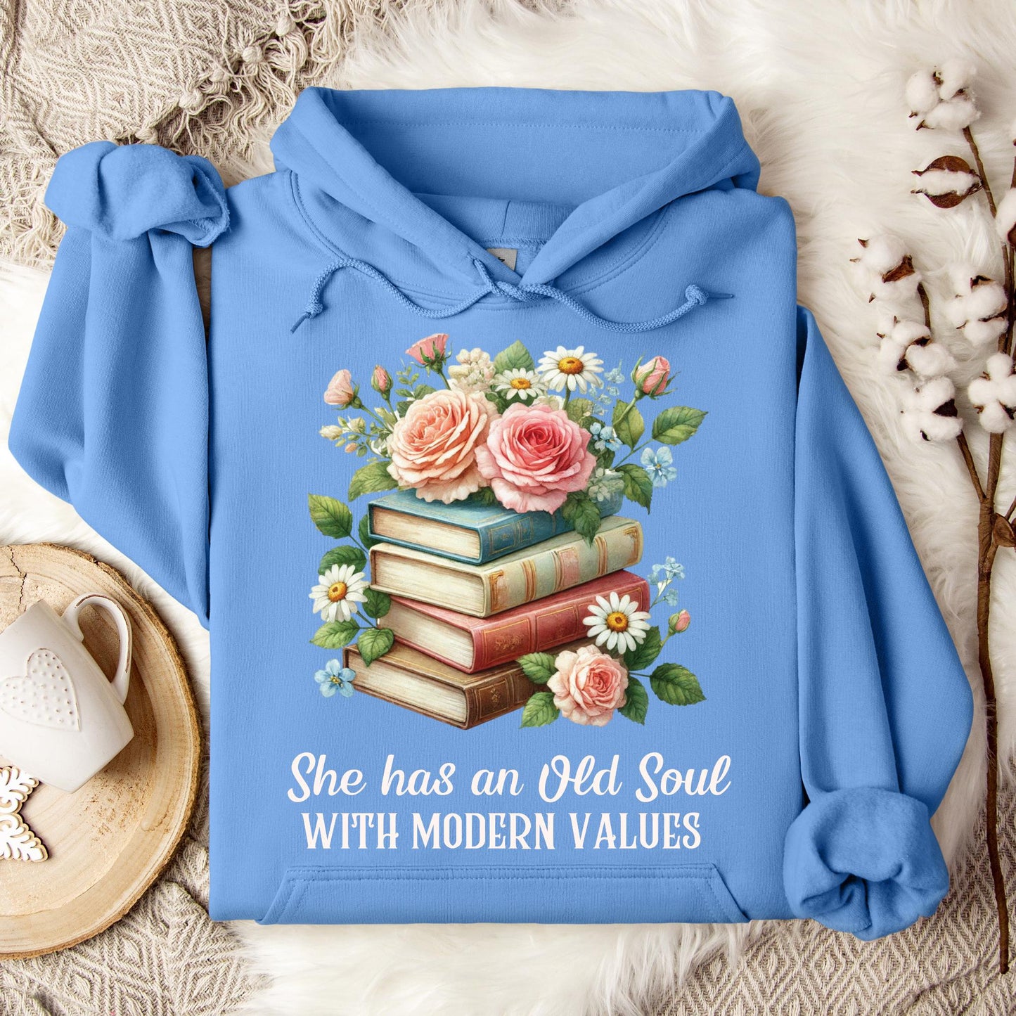 Carolina Blue Gildan 18500 hoodie with "She has an Old Soul WITH MODERN VALUES" text and floral book stack graphic.