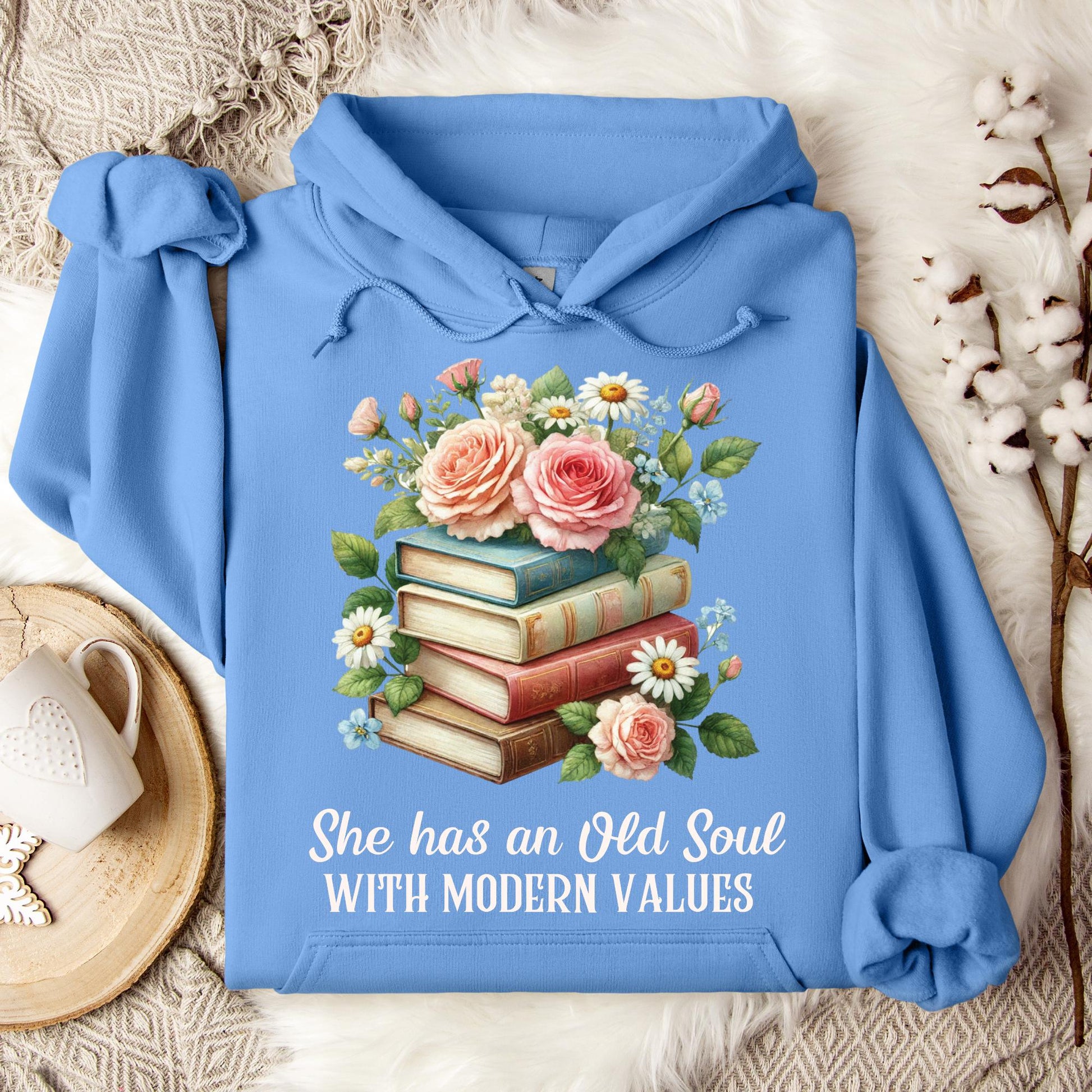 Carolina Blue Gildan 18500 hoodie with "She has an Old Soul WITH MODERN VALUES" text and floral book stack graphic.
