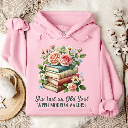 Light pink Gildan 18500 hoodie with a floral book stack graphic and "She has an Old Soul with Modern Values" text.