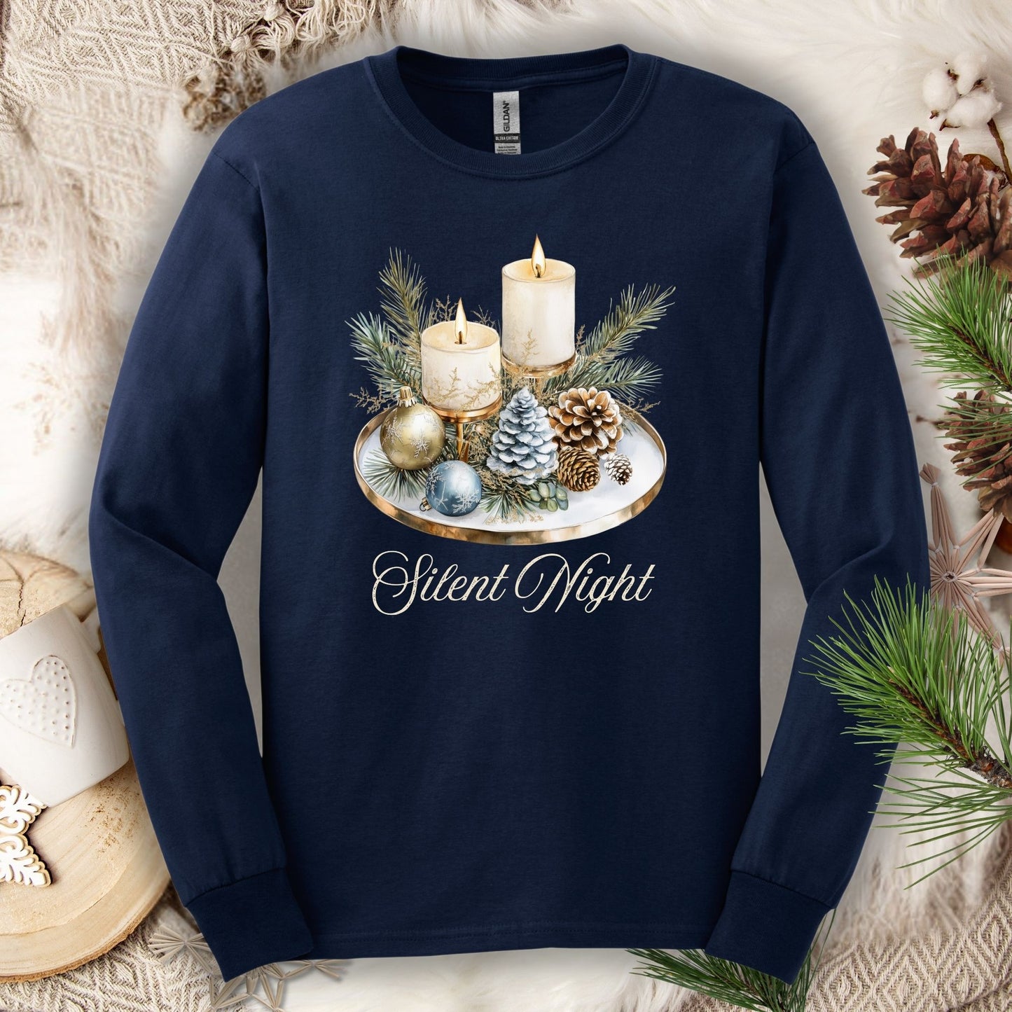 Navy long sleeve tee with a festive watercolor Advent arrangement and "Silent Night" text.