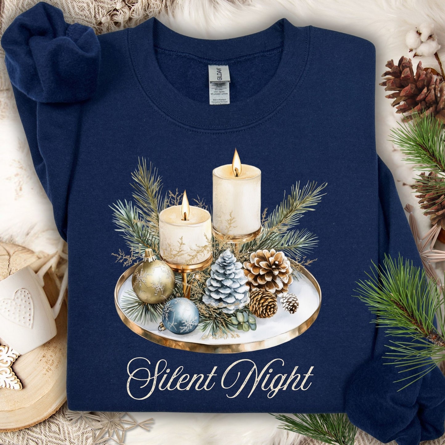 Navy Gildan sweatshirt with watercolor Silent Night advent arrangement: candles, pinecones, evergreens.
