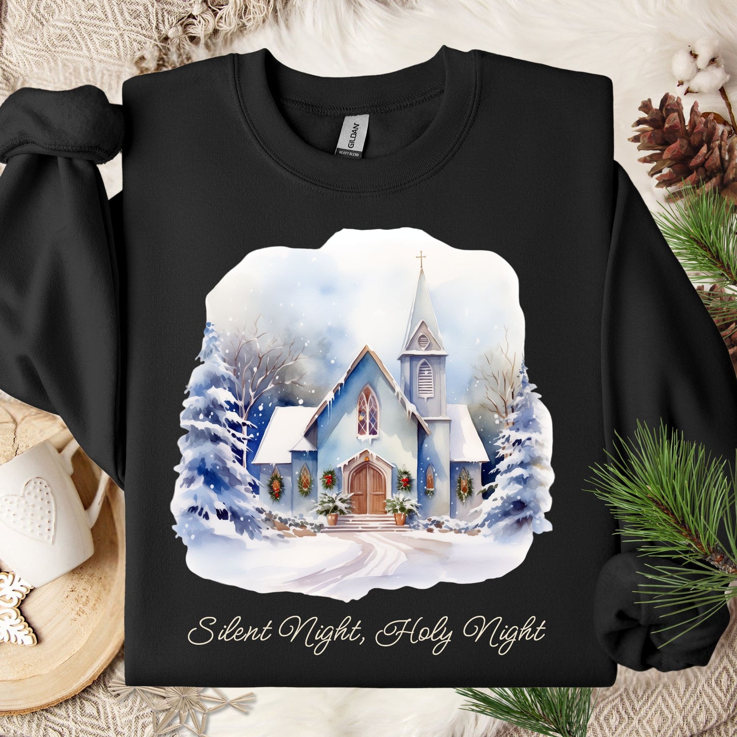 Black Gildan fleece sweatshirt with a snowy country chapel design and "Silent Night, Holy Night" text.