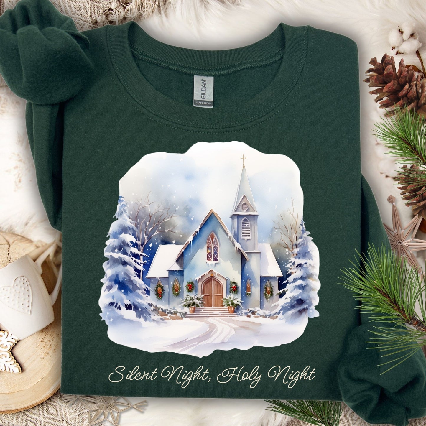 Forest green Gildan fleece sweatshirt with a snowy country chapel design and "Silent Night, Holy Night" text.
