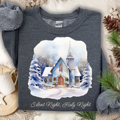 Dark heather Gildan fleece sweatshirt with a snowy chapel design and "Silent Night, Holy Night" text.