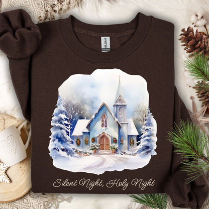 Dark chocolate Gildan fleece sweatshirt with a snowy chapel design and "Silent Night, Holy Night" text.