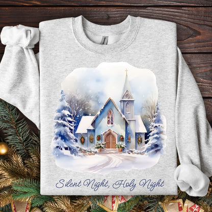 Ash Gildan fleece sweatshirt with a snowy country chapel design and "Silent Night, Holy Night" text.