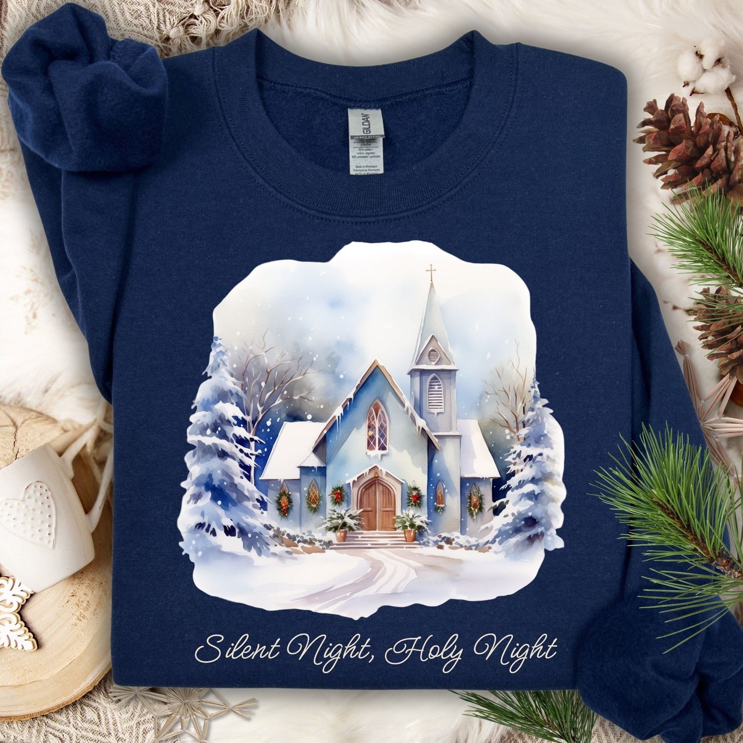 Navy Gildan fleece sweatshirt with a snowy chapel design and "Silent Night, Holy Night" text.