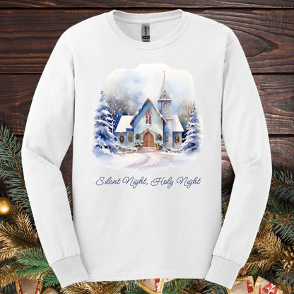 White heavyweight cotton long sleeve tee with watercolor snow-covered chapel and "Silent Night, Holy Night" text.