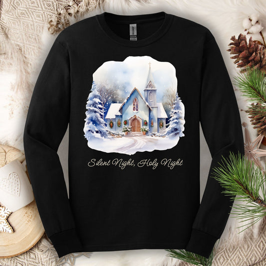 Black heavyweight cotton long sleeve tee with a watercolor snow-covered chapel and "Silent Night, Holy Night" text.