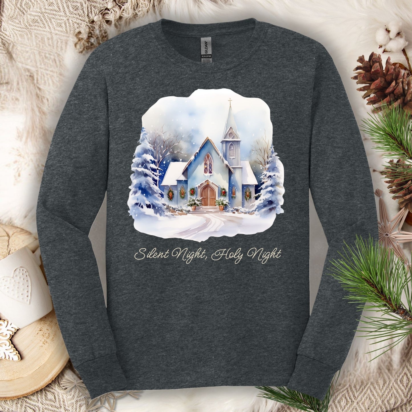 Dark Heather long sleeve tee with watercolor snow-covered chapel and "Silent Night, Holy Night" text.