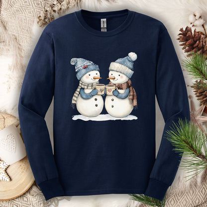 Navy long sleeve tee with two snowpeople in blue hats, mittens, and scarves holding hot chocolate.