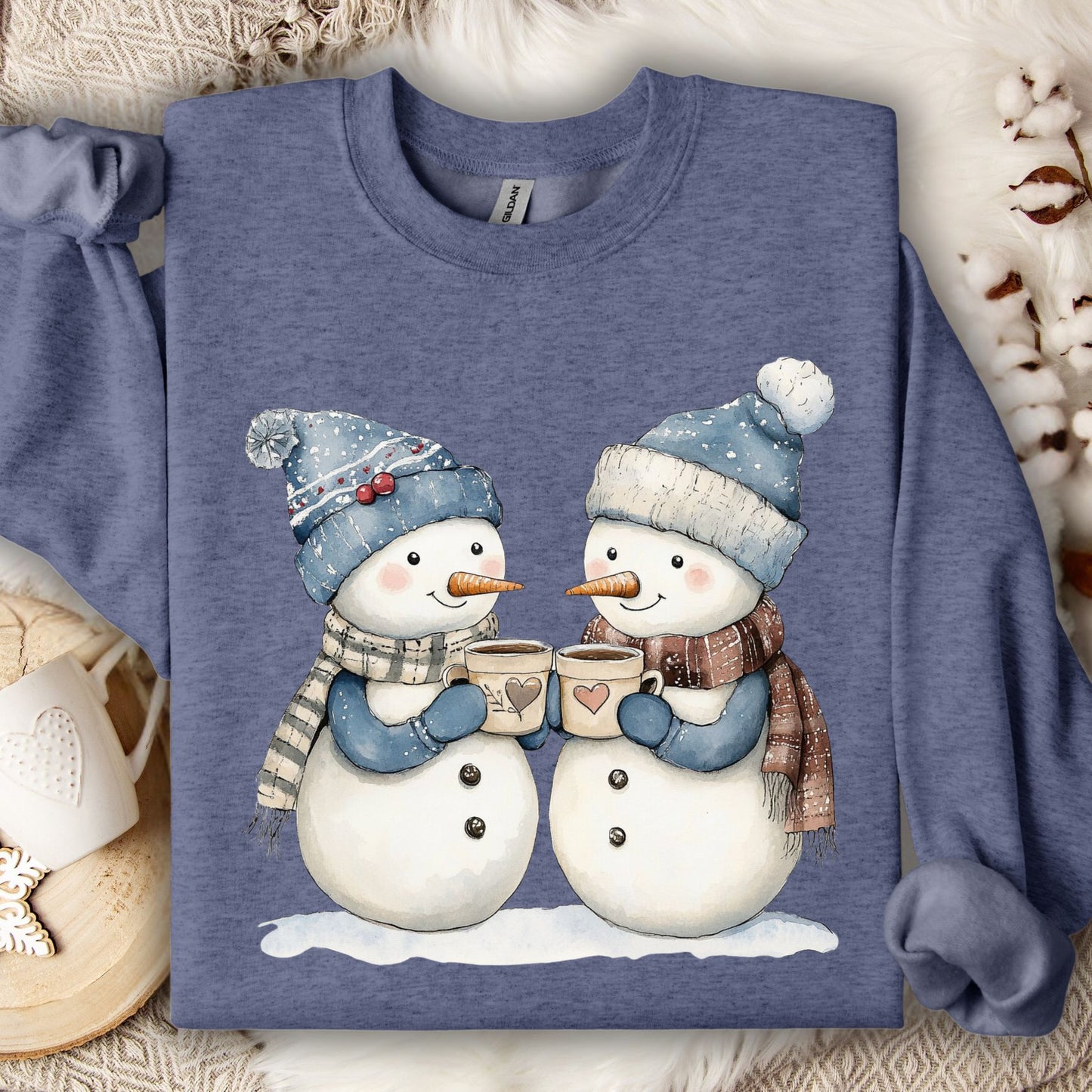 Heather Sport Dark Navy sweatshirt with two snowpeople in blue hats and scarves holding hot chocolate.