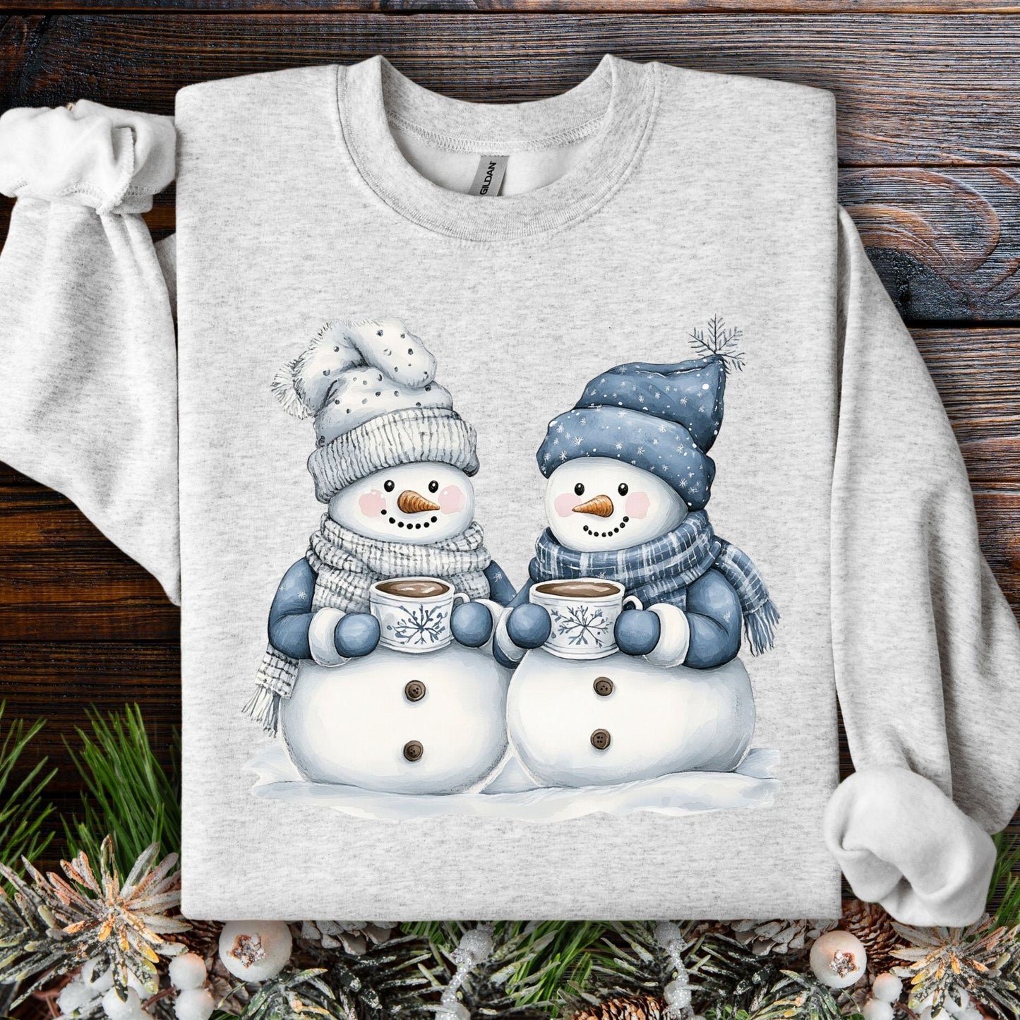 Ash gray cotton-polyester sweatshirt with two snowpeople in blue hats and scarves holding hot chocolate.