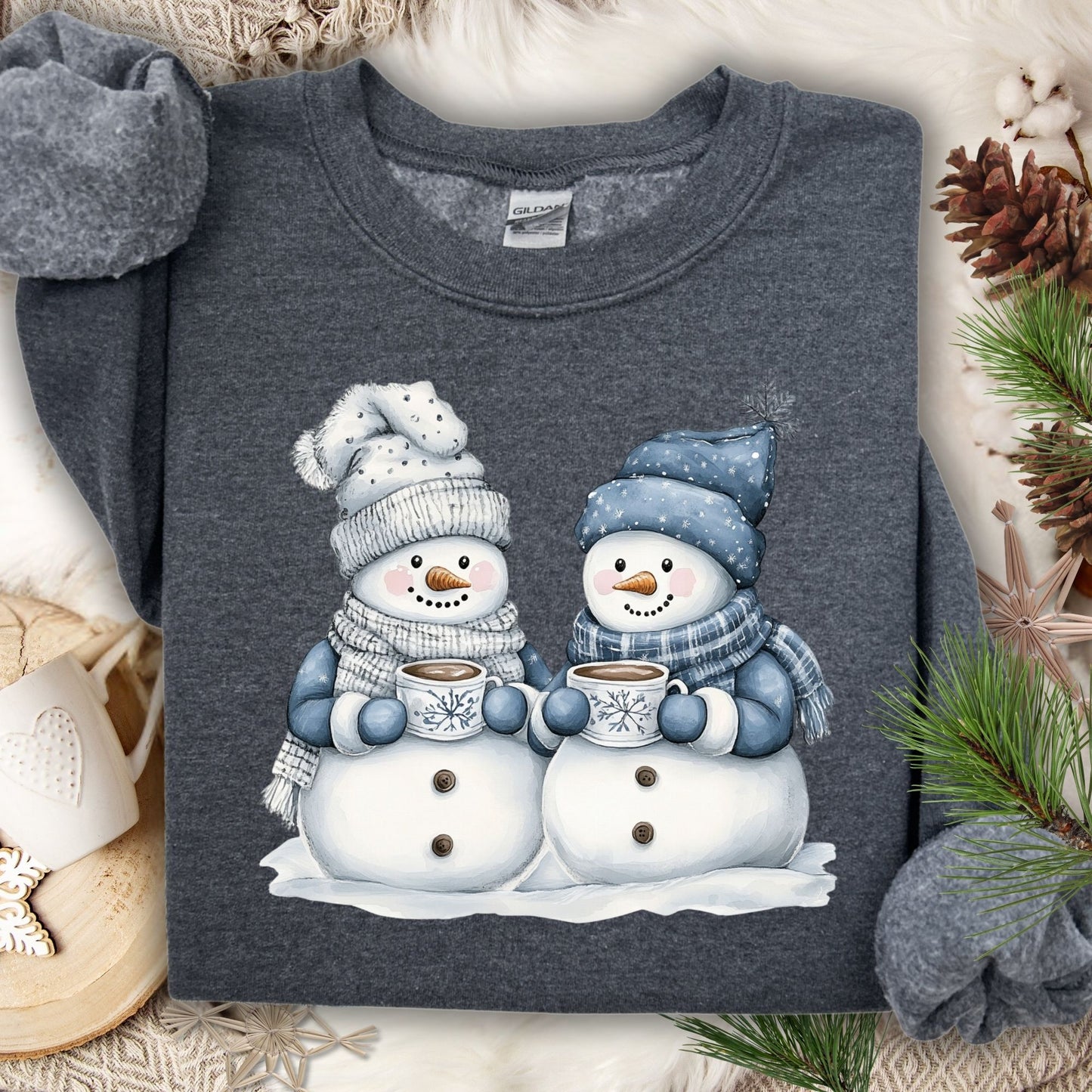 Dark Heather S sweatshirt with two snowpeople in blue hats and scarves holding hot chocolate.