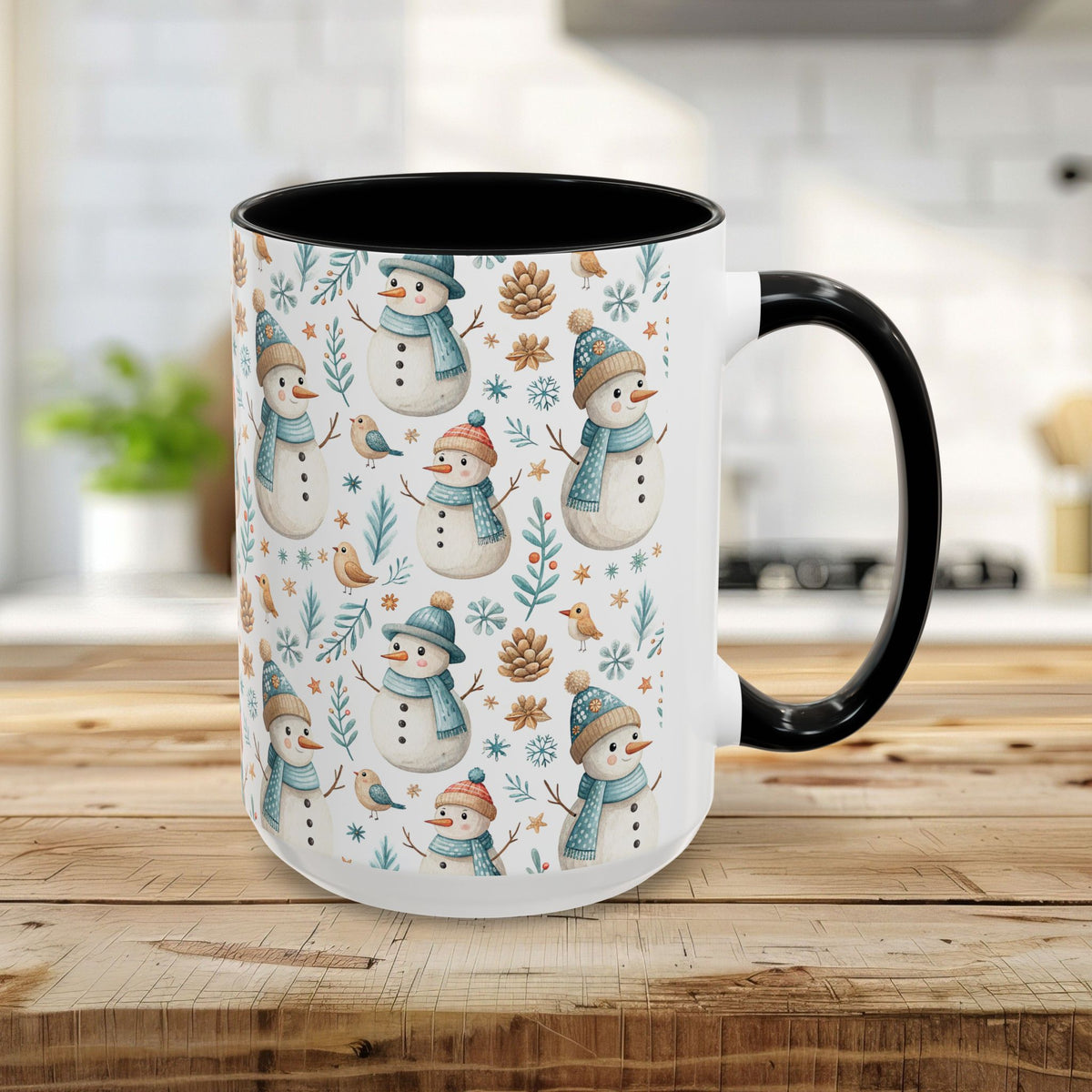 15oz ceramic mug with watercolor snowmen, birds, and pinecones on white, black interior and handle.