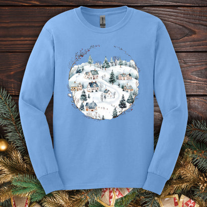 Carolina Blue Gildan Softstyle long sleeve tee with a watercolor Nordic snowy winter village design.