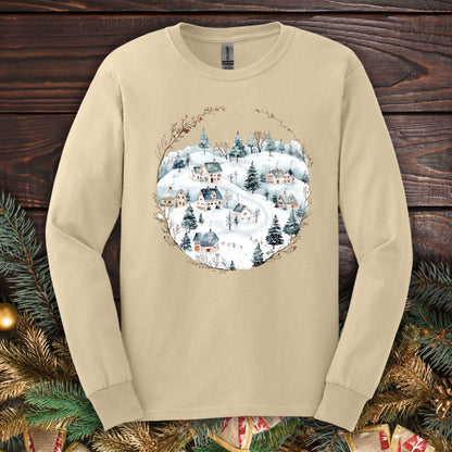 Sand Gildan Softstyle long sleeve tee with a watercolor folk-art snowy winter village design.