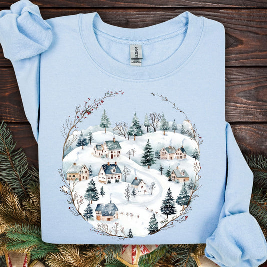 Light blue Gildan fleece sweatshirt with a watercolor folk-art Nordic winter village design.