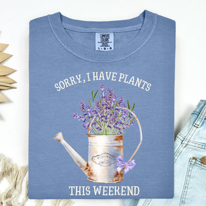 Blue Jean Comfort Colors t-shirt with "Sorry, I Have Plants This Weekend" text and a vintage watering can with lavender.