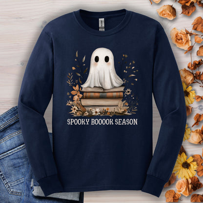 Navy Gildan long sleeve tee with a cute ghost on books, fall wildflowers, and "Spooky Boooook Season" text.