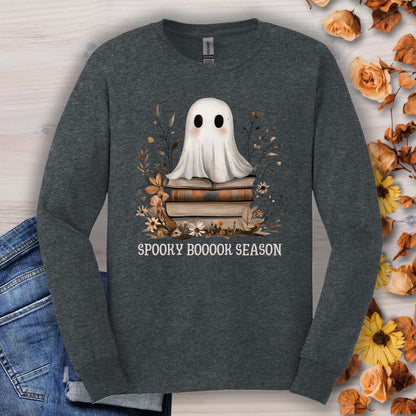 Dark Heather Gildan long sleeve tee with a boho ghost on books, wildflowers, and "Spooky Boooook Season" text.