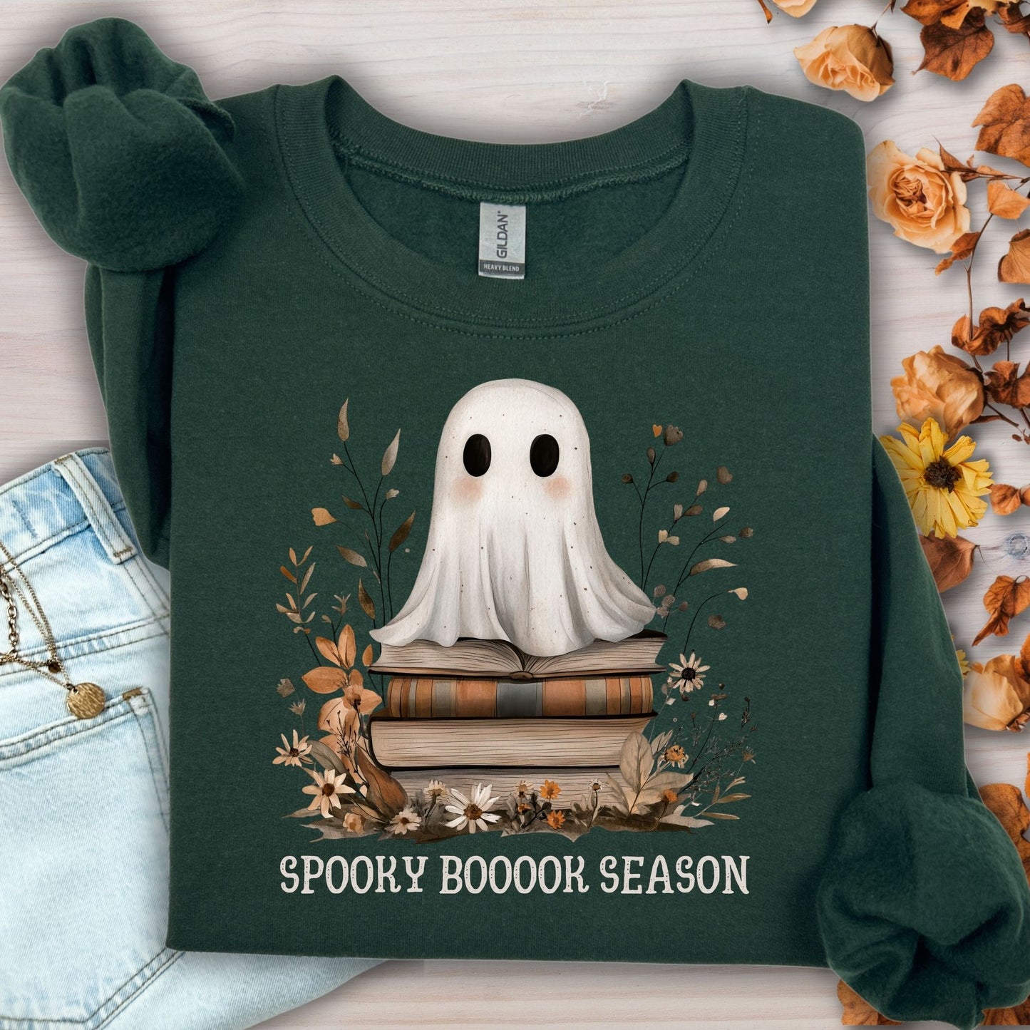 Forest Green Gildan sweatshirt with a boho ghost on vintage books and autumn wildflowers.