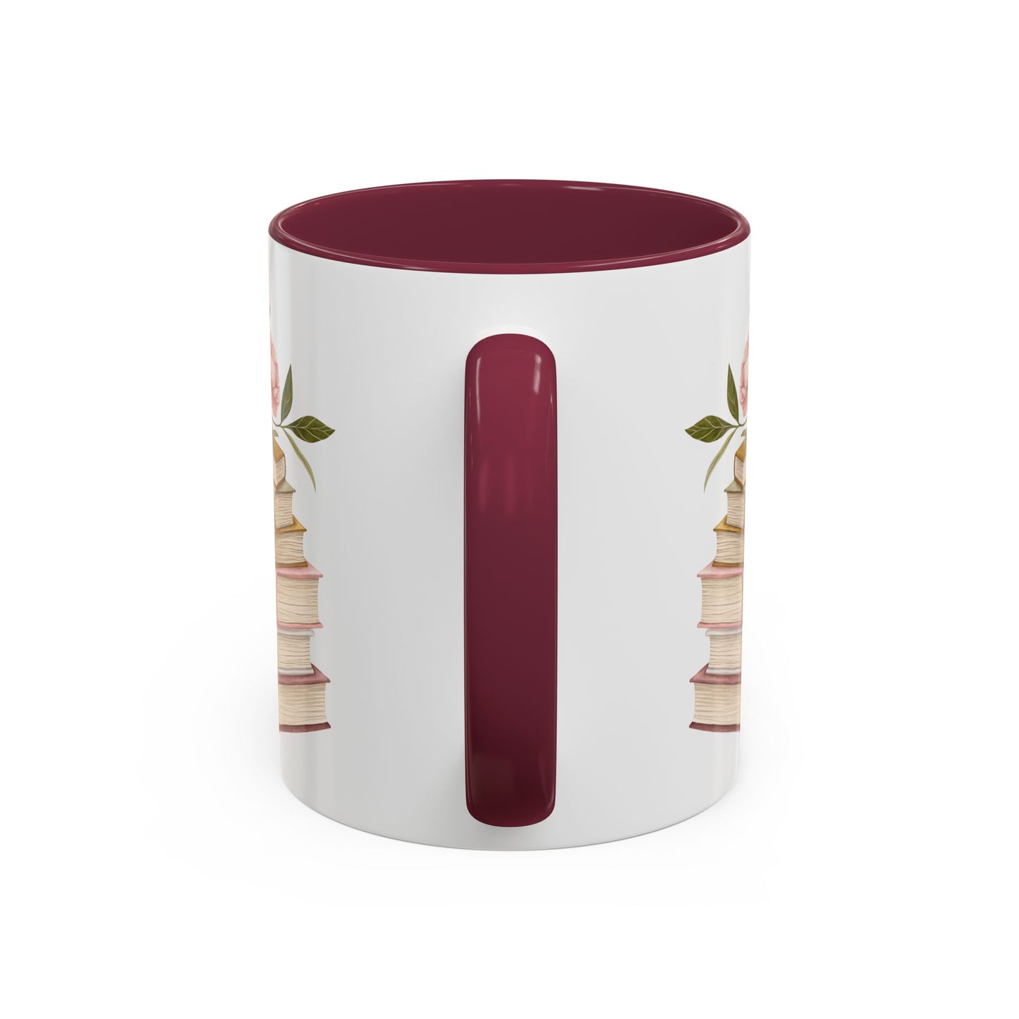 White ceramic mug with a burgundy handle and interior, featuring a watercolor stack of books and floral accents.