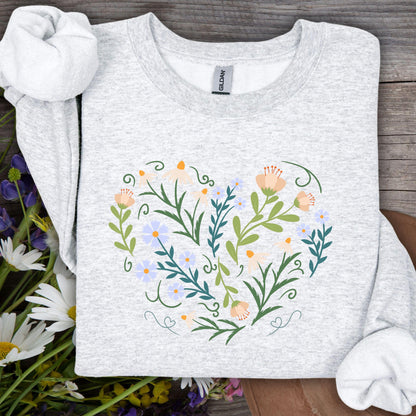 Ash gray sweatshirt with a heart-shaped floral design of daisies, tulips, and vines.