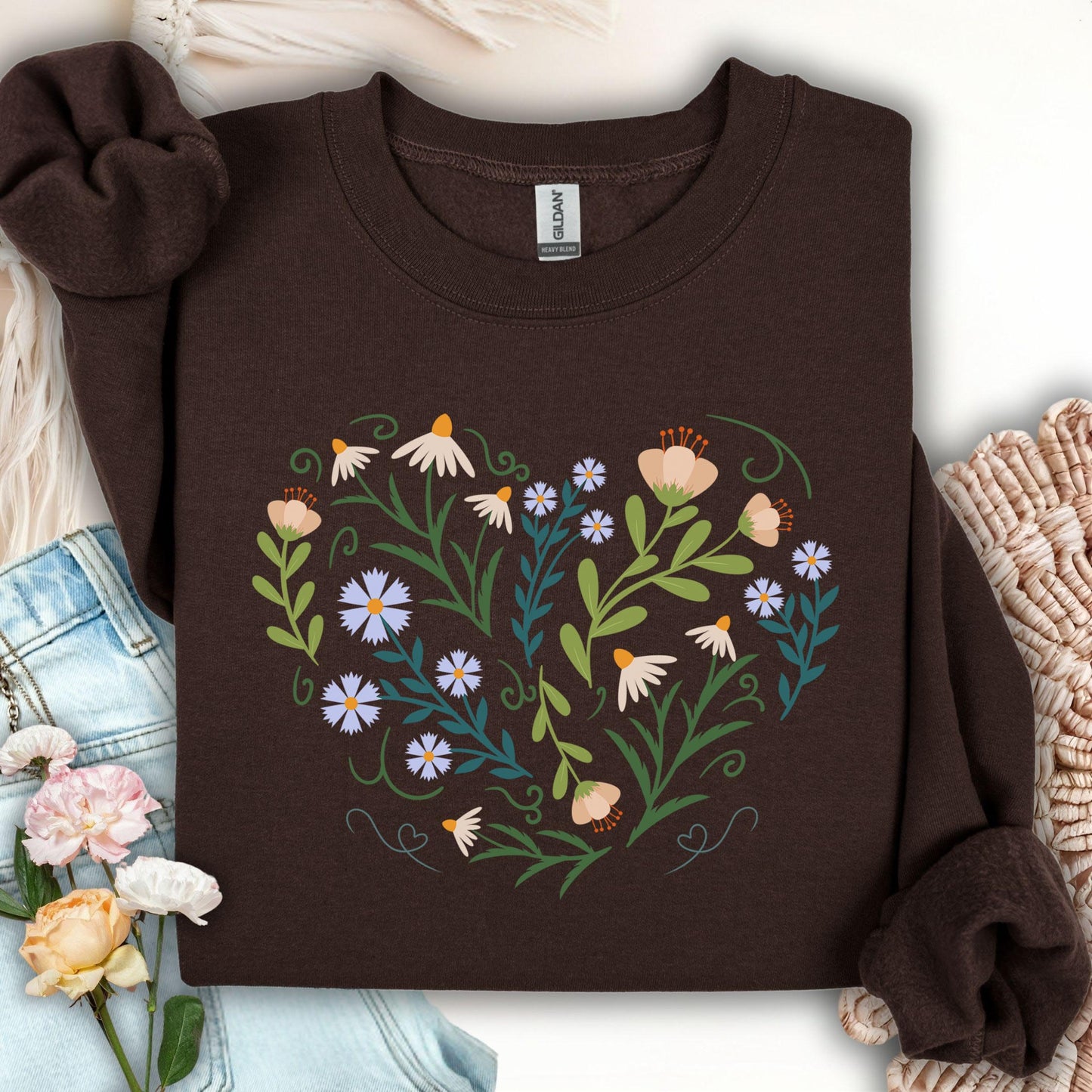 Dark Chocolate sweatshirt with a heart-shaped botanical illustration of wildflowers and leaves.