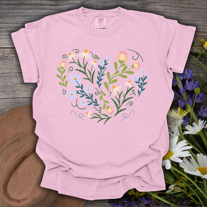 Blossom pink S-size t-shirt with a heart-shaped botanical wildflower design and ornamental swirls.