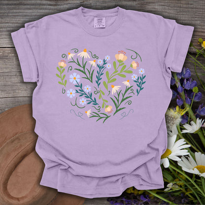 Orchid S t-shirt with a heart-shaped botanical illustration of wildflowers, foliage, and curling vines.