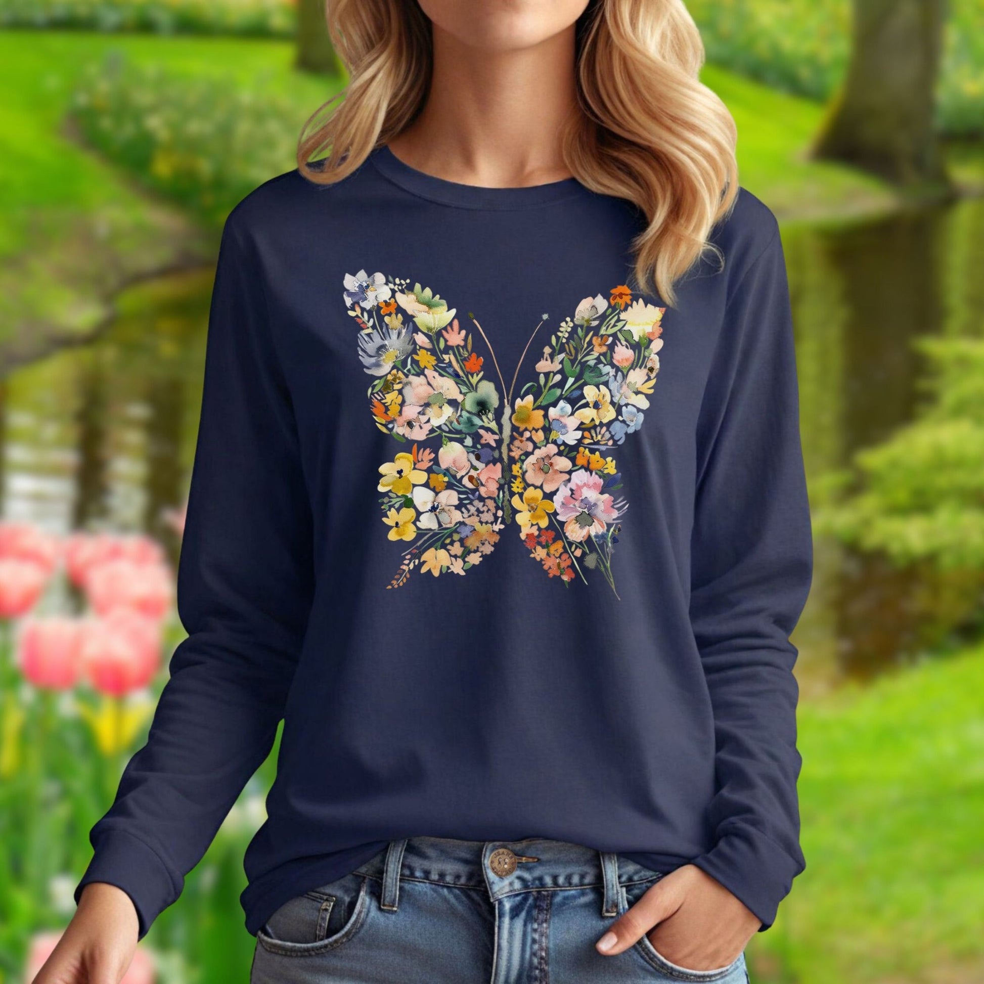Navy long sleeve tee with a watercolor floral butterfly design, featuring daisies, roses, and foliage.