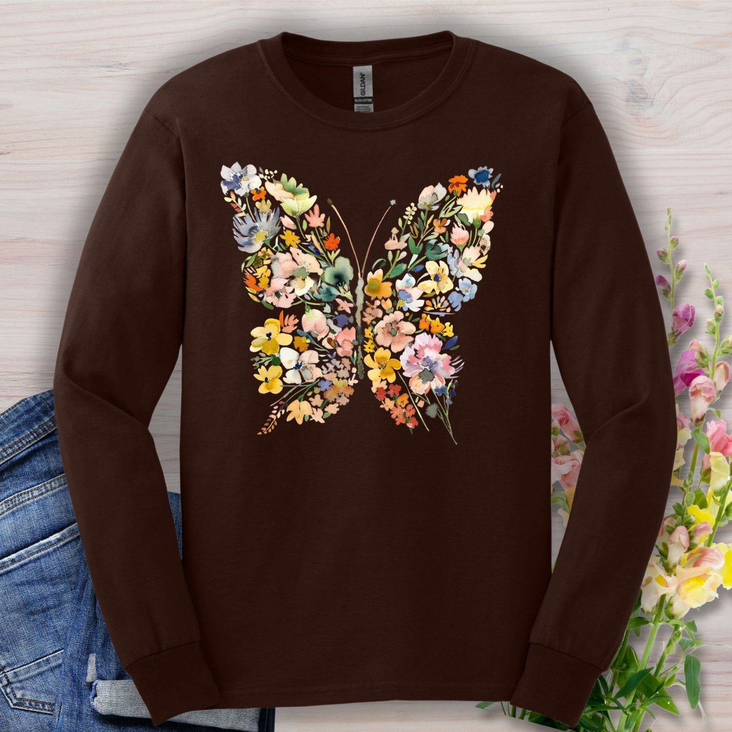 Dark Chocolate long sleeve tee with a colorful floral butterfly design, made of 50/50 cotton-poly fabric.