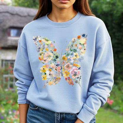Light blue sweatshirt with a large, colorful butterfly design made of watercolor-style flowers and leaves.
