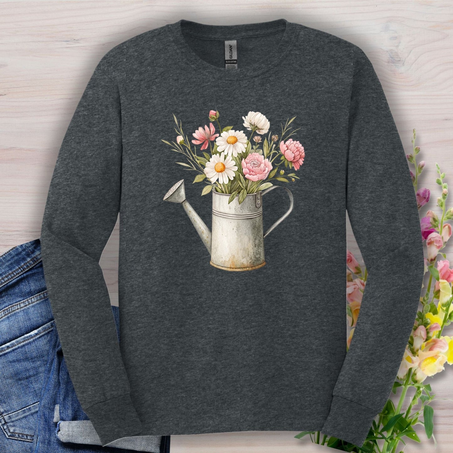 Dark Heather long sleeve tee with a vintage watering can and botanical floral illustration.